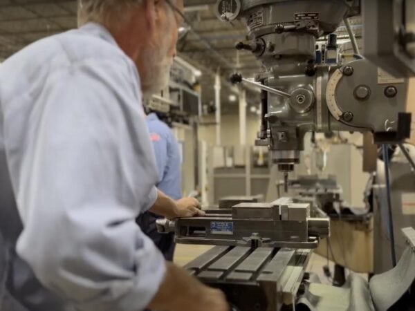 Man working with repair & refurbishment machines